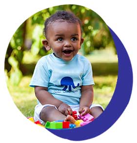 Young child outside with toys